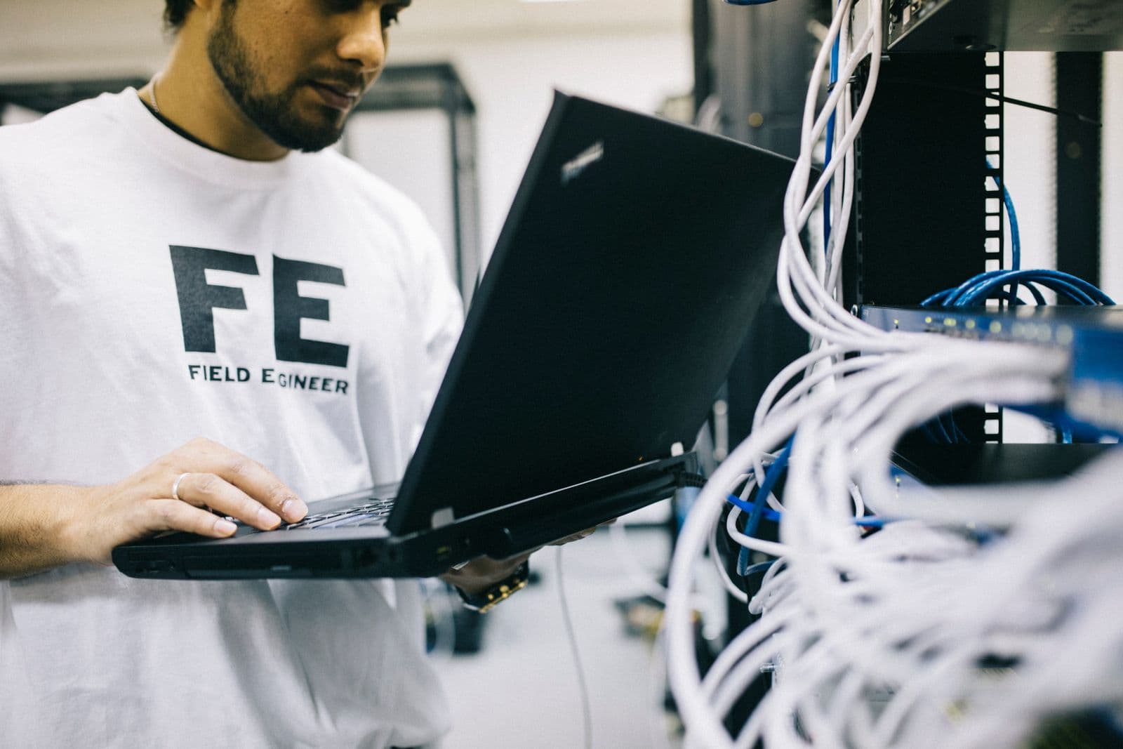 Engineer maintaining server network equipment